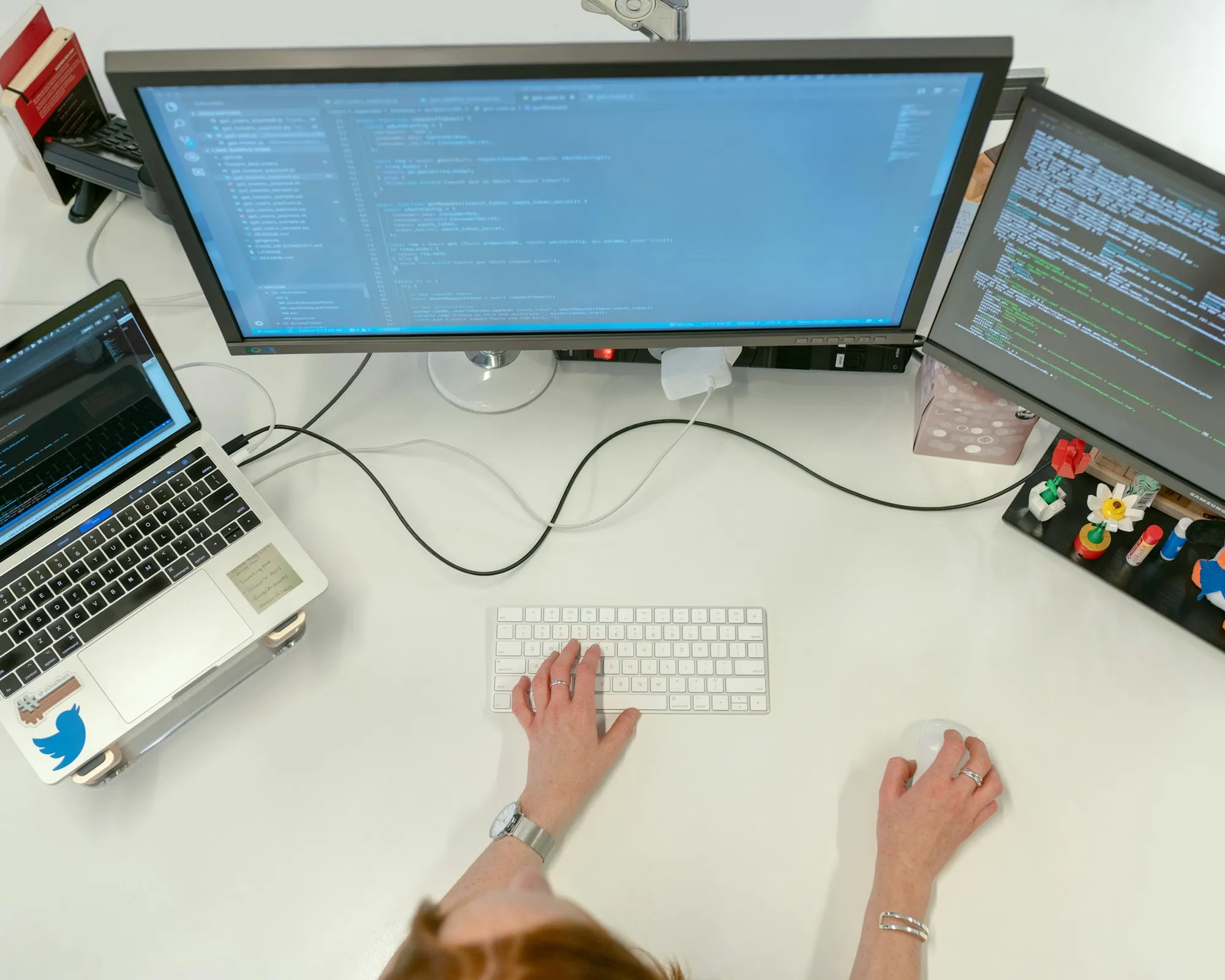 Medical billing coder analyzing claims and charge records on a desktop display