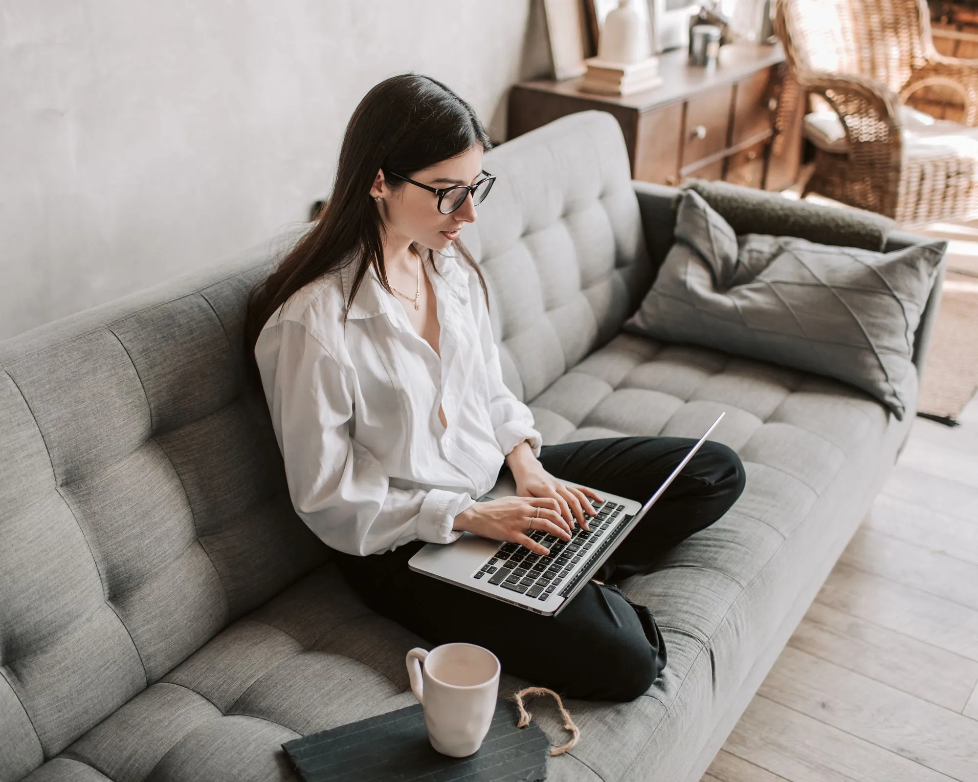 Prospective patient at home using a laptop to find specialized care